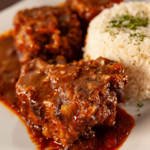 Light Rail Cafe's oxtail stew with rich brown sauce and a side of white rice.
